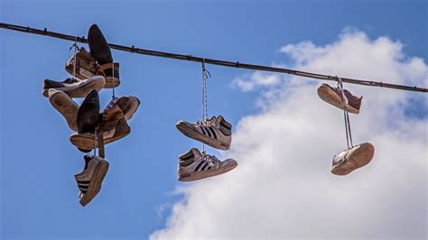 shoes hanging from wires meaning